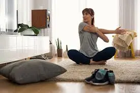 Woman doing yoga as a treatment for TMJ pain